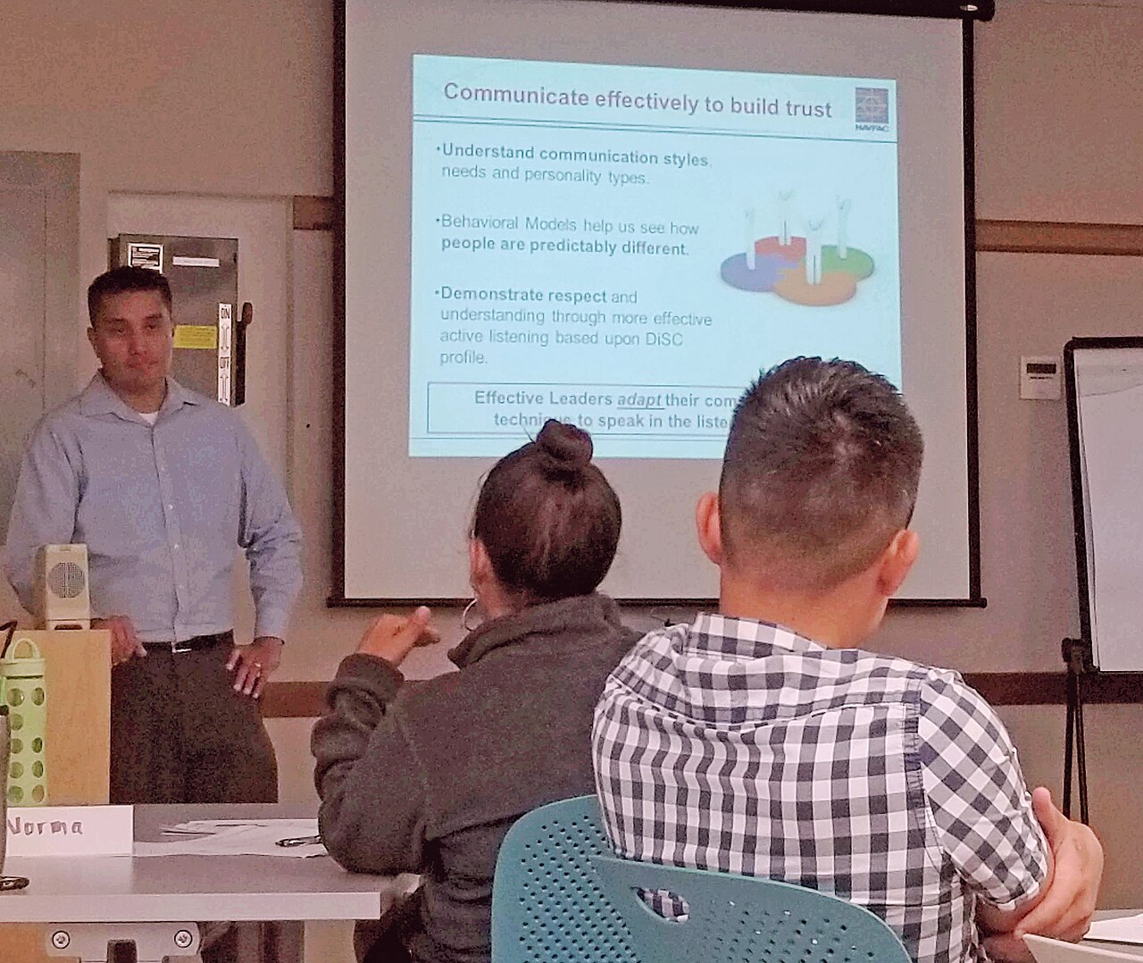 Presenter leading a professional training workshop