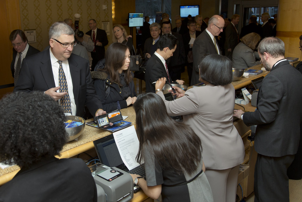 Conference guests at a registration area