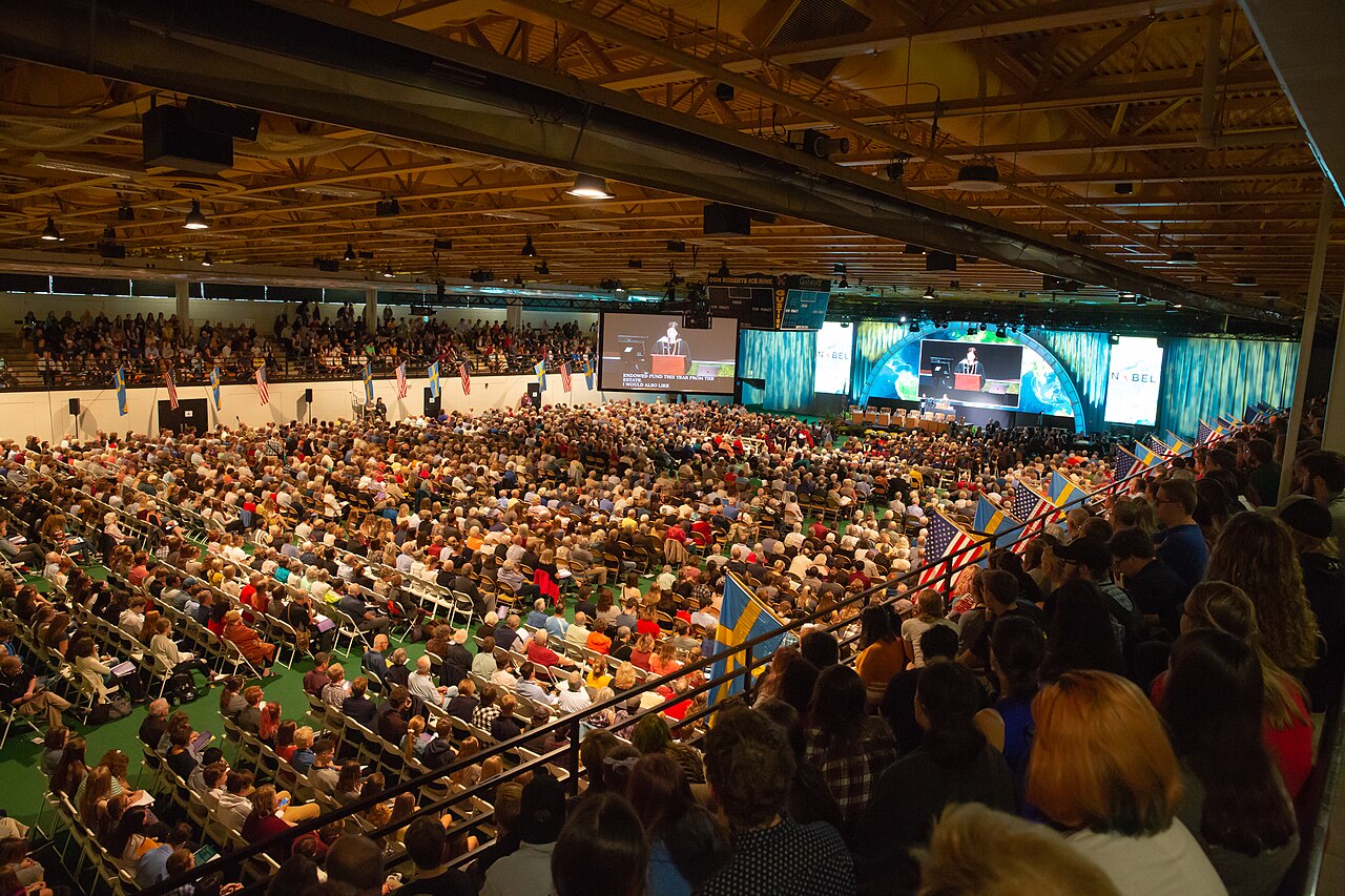 Audience gathered for a large conference presentation